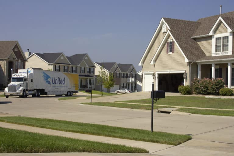 United truck driving through a neighborhood