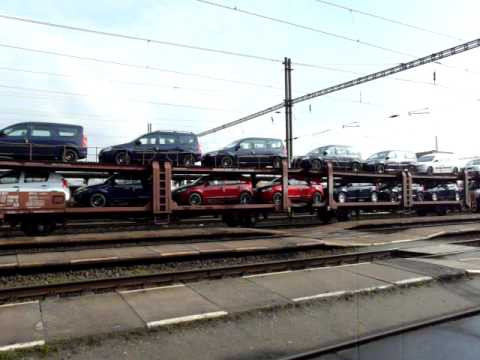 train transporting cars