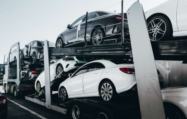 Big car carrier truck of new luxury sport cars