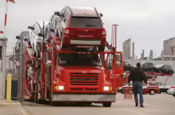 A load of cars leaves a Chrysler assembly plant in Belvidere, Ill. Car makers log hundreds of millions of miles on the road deliver automobiles to dealerships across the country.